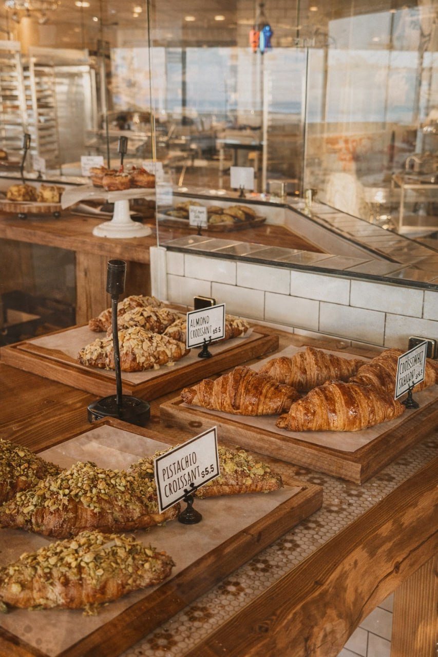 Almond and pistachio croissants fresh-baked in the bai-tee pastry case